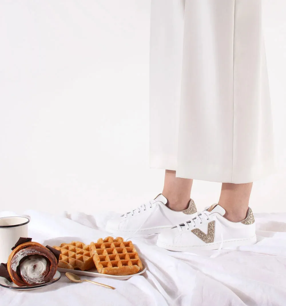 White sneaker with nude glitter logo